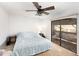Bedroom with a sliding glass door and ceiling fan, offering a serene retreat with natural light at 799 Fairwood Ln, Clearwater, FL 33759