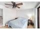 Bedroom featuring a ceiling fan and neutral decor, creating a relaxing and inviting atmosphere at 799 Fairwood Ln, Clearwater, FL 33759