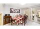 Bright dining room with a view of the backyard through a glass door and light tile flooring at 799 Fairwood Ln, Clearwater, FL 33759
