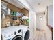 Convenient in-unit laundry area with ample storage and modern appliances, adding functionality to the home at 799 Fairwood Ln, Clearwater, FL 33759