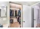 Spacious walk-in closet provides ample storage with organized shelves and hanging space, maximizing functionality at 799 Fairwood Ln, Clearwater, FL 33759