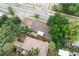 Aerial view of single-Gathering home with a spacious yard, fenced perimeter, and convenient driveway at 8319 N 14Th St, Tampa, FL 33604