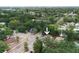 An aerial view of a charming single-story home nestled among lush trees in a serene residential area at 8319 N 14Th St, Tampa, FL 33604