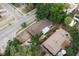 An aerial view of a well-maintained home featuring a spacious yard and convenient street access at 8319 N 14Th St, Tampa, FL 33604