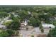 An aerial view of a charming single-story home surrounded by lush green trees in a residential neighborhood at 8319 N 14Th St, Tampa, FL 33604