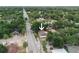 An aerial shot showcasing a charming single-story home nestled in a quiet, tree-lined neighborhood at 8319 N 14Th St, Tampa, FL 33604