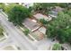 Aerial view of two well-kept homes with large yards, fenced perimeter, and convenient street access at 8319 N 14Th St, Tampa, FL 33604