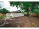 The backyard has a sturdy wooden fence, providing privacy and security for outdoor enjoyment at 8319 N 14Th St, Tampa, FL 33604
