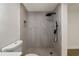 Modern bathroom featuring a tiled shower with a rainfall showerhead and updated fixtures at 8319 N 14Th St, Tampa, FL 33604