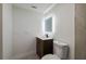 Bathroom featuring a modern vanity, toilet, and modern lighting at 8319 N 14Th St, Tampa, FL 33604