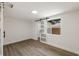 Bright bedroom featuring hardwood-style floors and a barn-style closet door at 8319 N 14Th St, Tampa, FL 33604