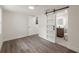 Bedroom with an ensuite bathroom and hardwood-style floors at 8319 N 14Th St, Tampa, FL 33604