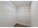 Walk-in closet with white walls and wire shelving perfect for organizing clothes and accessories at 8319 N 14Th St, Tampa, FL 33604
