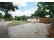 Charming single-story home with a well-maintained yard and wooden fence, perfect for outdoor enjoyment at 8319 N 14Th St, Tampa, FL 33604