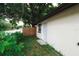 Home exterior with a charming front entrance and lush greenery, giving a welcoming feel at 8319 N 14Th St, Tampa, FL 33604