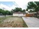 Charming single-story home featuring a neutral exterior, updated landscaping, and a private driveway at 8319 N 14Th St, Tampa, FL 33604