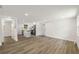 Open-concept living area with new flooring, modern kitchen, and plenty of natural light at 8319 N 14Th St, Tampa, FL 33604