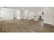 Spacious living room with open floor plan and hardwood-style floors at 8319 N 14Th St, Tampa, FL 33604