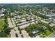 Picturesque aerial view of a sprawling residential area with mature trees and a variety of home styles at 858 Cambridge Ct # 858, Dunedin, FL 34698