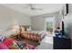 Comfortable bedroom featuring natural light, a cozy bed, and a serene atmosphere at 858 Cambridge Ct # 858, Dunedin, FL 34698