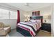 Comfortable bedroom with a stylish bed, complementary decor, and ample natural light, creating a serene retreat at 858 Cambridge Ct # 858, Dunedin, FL 34698