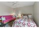 Comfortable bedroom featuring natural light, a cozy bed, and a serene atmosphere at 858 Cambridge Ct # 858, Dunedin, FL 34698