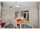 Eat-in dining area offers a ceiling fan and an open floor plan with convenient access to the kitchen at 858 Cambridge Ct # 858, Dunedin, FL 34698