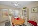 Bright dining room with natural light, display cabinet, and outdoor access at 858 Cambridge Ct # 858, Dunedin, FL 34698