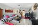 Comfortable living room with neutral tones, modern decor, and a partial view into the kitchen, for relaxation and socializing at 858 Cambridge Ct # 858, Dunedin, FL 34698