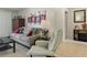 Inviting living room featuring a comfortable couch, stylish decor, and ample natural light at 858 Cambridge Ct # 858, Dunedin, FL 34698