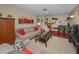 Inviting living room with modern decor, comfortable seating, and a seamless flow to the kitchen at 858 Cambridge Ct # 858, Dunedin, FL 34698