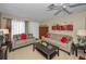 Comfortable living room with tile floors, ceiling fan and bright lighting at 858 Cambridge Ct # 858, Dunedin, FL 34698