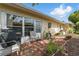 Outdoor patio perfect for grilling and relaxing, complete with a patio set and garden accents at 858 Cambridge Ct # 858, Dunedin, FL 34698