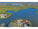 Incredible aerial view of the property showcasing its waterfront location and lush surroundings at 1214 Stover Ct, Holiday, FL 34691