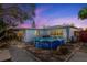 Backyard featuring an above-ground pool, covered patio and paved walkway to the house at 1214 Stover Ct, Holiday, FL 34691