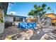 Relaxing backyard featuring an above-ground pool, storage shed, and a well-maintained brick patio at 1214 Stover Ct, Holiday, FL 34691