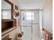 Bathroom featuring a glass-enclosed shower, and wooden towel racks at 1214 Stover Ct, Holiday, FL 34691