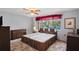 Spacious bedroom with ample storage, natural light, and a relaxing atmosphere at 1214 Stover Ct, Holiday, FL 34691