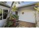 Entrance with plants and trees adding to the natural charm at 1214 Stover Ct, Holiday, FL 34691