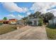 Well-maintained exterior of the house, featuring a large driveway at 1214 Stover Ct, Holiday, FL 34691