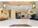 Large kitchen with a breakfast bar, wooden cabinets, and an open layout at 1214 Stover Ct, Holiday, FL 34691