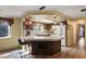 Eat-in kitchen features a breakfast bar with two chairs and matching pendants above at 1214 Stover Ct, Holiday, FL 34691