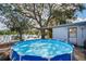 Relax by the pool with a lake view at this serene backyard getaway at 1214 Stover Ct, Holiday, FL 34691