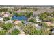 Beautiful home boasts private backyard and serene lake view; lush trees ensure privacy in a desirable location at 10218 Garden Alcove Dr, Tampa, FL 33647