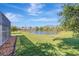 Spacious backyard features well-maintained lawn and a picturesque pond view at 10218 Garden Alcove Dr, Tampa, FL 33647