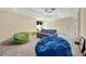 Spacious finished basement with comfortable beanbag chairs and tray ceiling detail at 10218 Garden Alcove Dr, Tampa, FL 33647