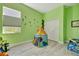 Cheerful ' bedroom with a play tent, closet and accent wall decals at 10218 Garden Alcove Dr, Tampa, FL 33647