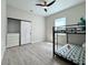 Neutral bedroom with a wood-look floors, black trim and a bunk bed set at 10218 Garden Alcove Dr, Tampa, FL 33647