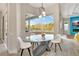 Bright dining area with views of the pool and screened in lanai at 10218 Garden Alcove Dr, Tampa, FL 33647