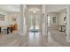 Inviting foyer with tiled floors, a decorative front door, and ample natural light at 10218 Garden Alcove Dr, Tampa, FL 33647